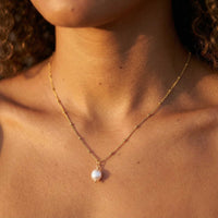 Thumbnail for Pearl Drop Necklace by Brother & Sisters featuring a lustrous baroque pearl on a textured satellite chain.