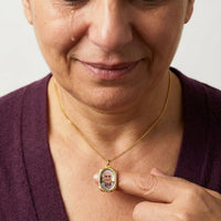 Thumbnail for Woman moved as she looks at her late husband's photo in the gold oval necklace | SKU: TPH-OVLN-GOLD