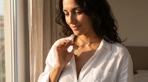 Affordable Luxury Jewelry That Feels Personal: golden sun necklace worn, personalized jewelry in 304L stainless steel