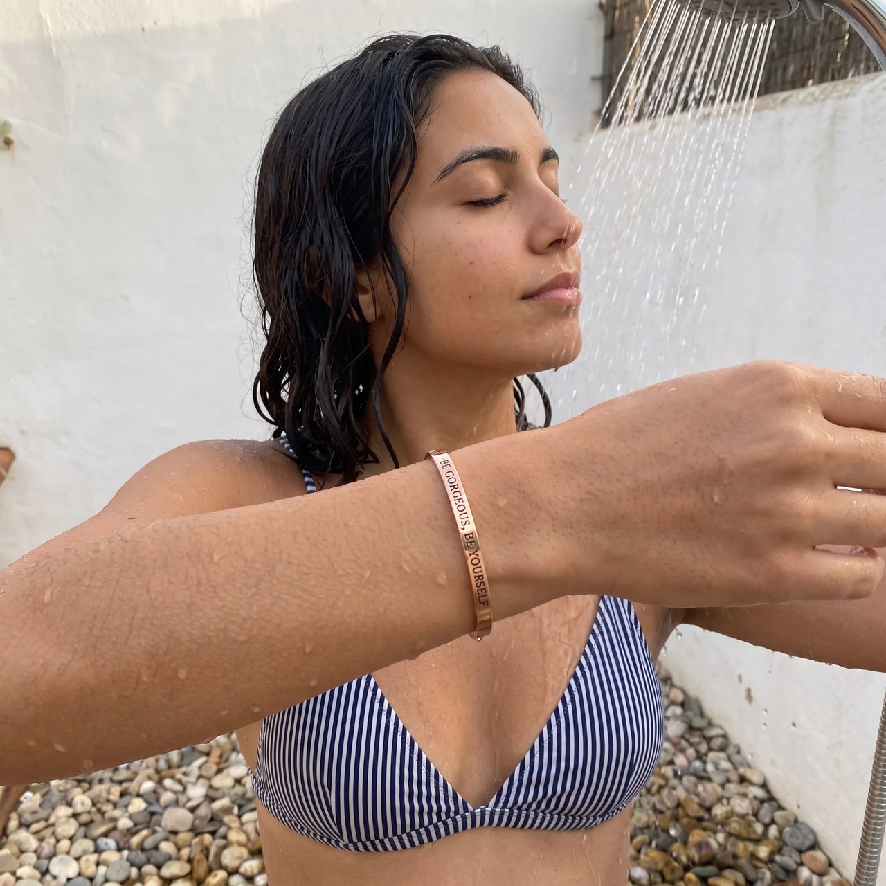 Be Gorgeous, Be Yourself bracelet in rose gold worn in an outdoor shower | SKU: bgby-rg