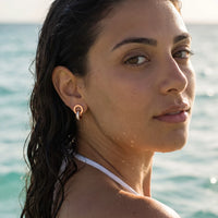 Thumbnail for Rose gold huggie hoop earrings worn in the sea, waterproof stainless steel with water drops | SKU: 11137578-rose-gold