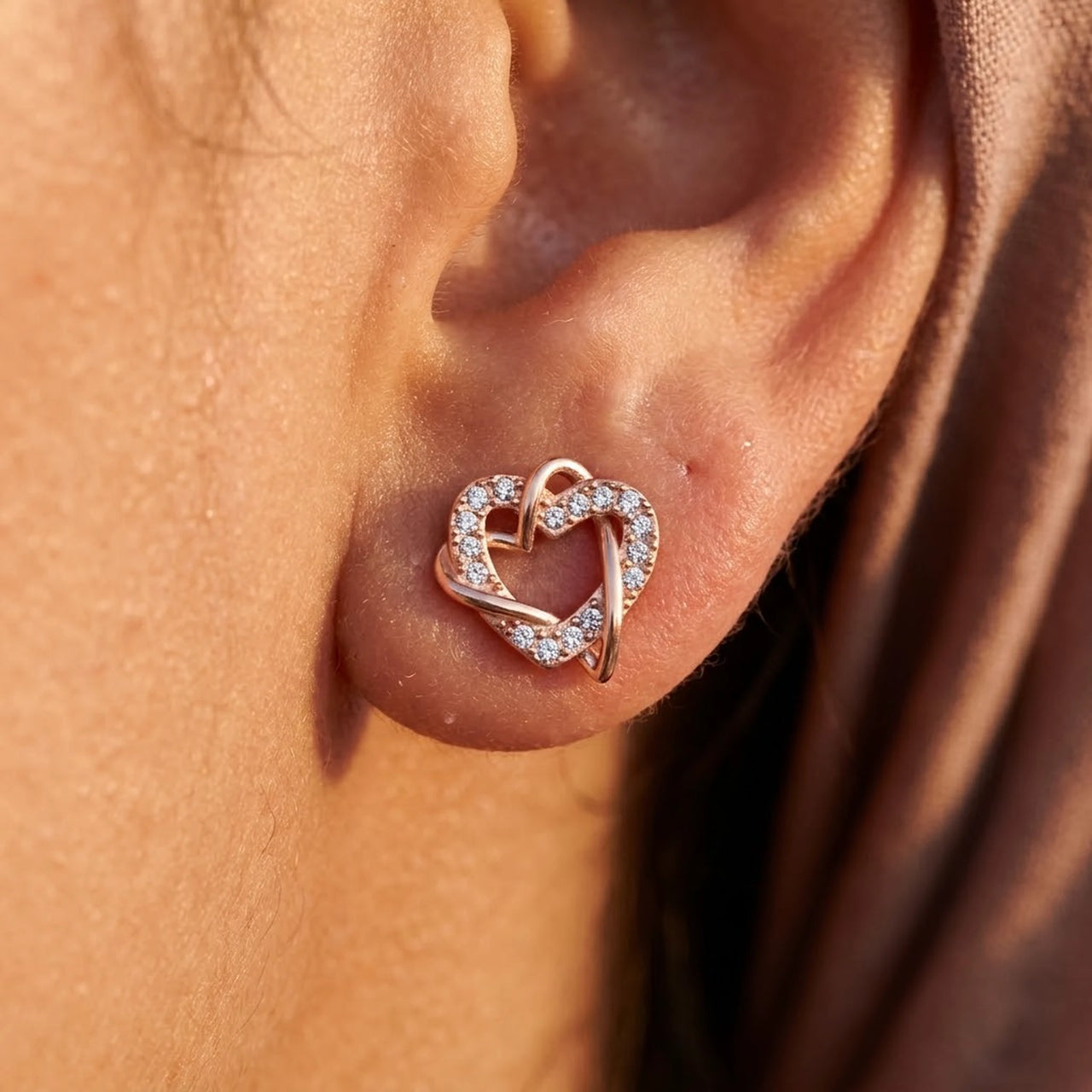 Close-up of the rose gold stud earrings worn on the skin | SKU: 419593-rose-gold