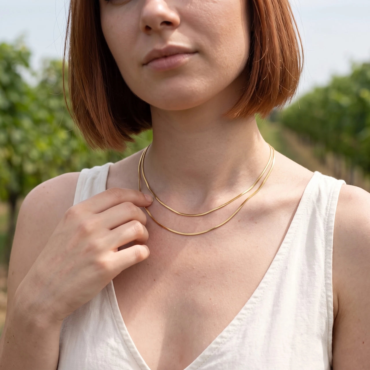 The Simple, gold necklace — worn gesture | SKU: lesimplenecklace