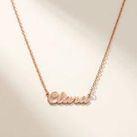 Thumbnail for Minimalist Name Necklace in rose gold laid flat, cursive cut-metal script, the name Clara | SKU: minimalistnn-rosegold