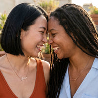 Thumbnail for Minimalist Name Necklace in rose gold worn by two women laughing together, the name Yuna and Oceane | SKU: minimalistnn-rosegold