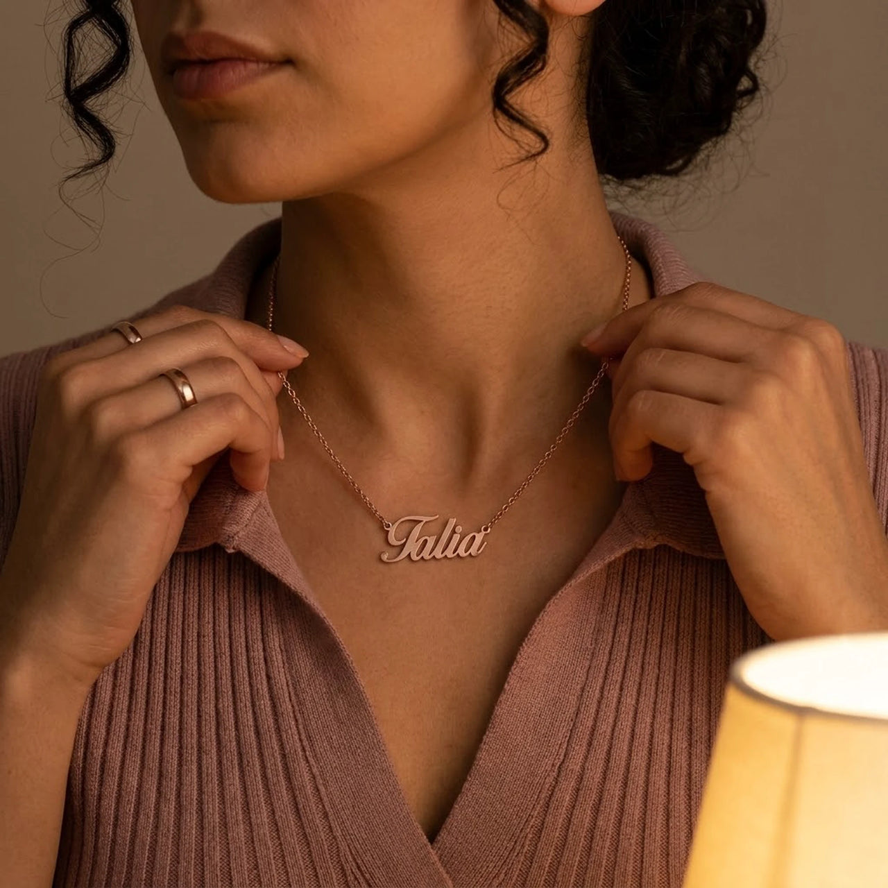 Minimalist Name Necklace in rose gold held at the neckline with both hands, the name Talia | SKU: minimalistnn-rosegold