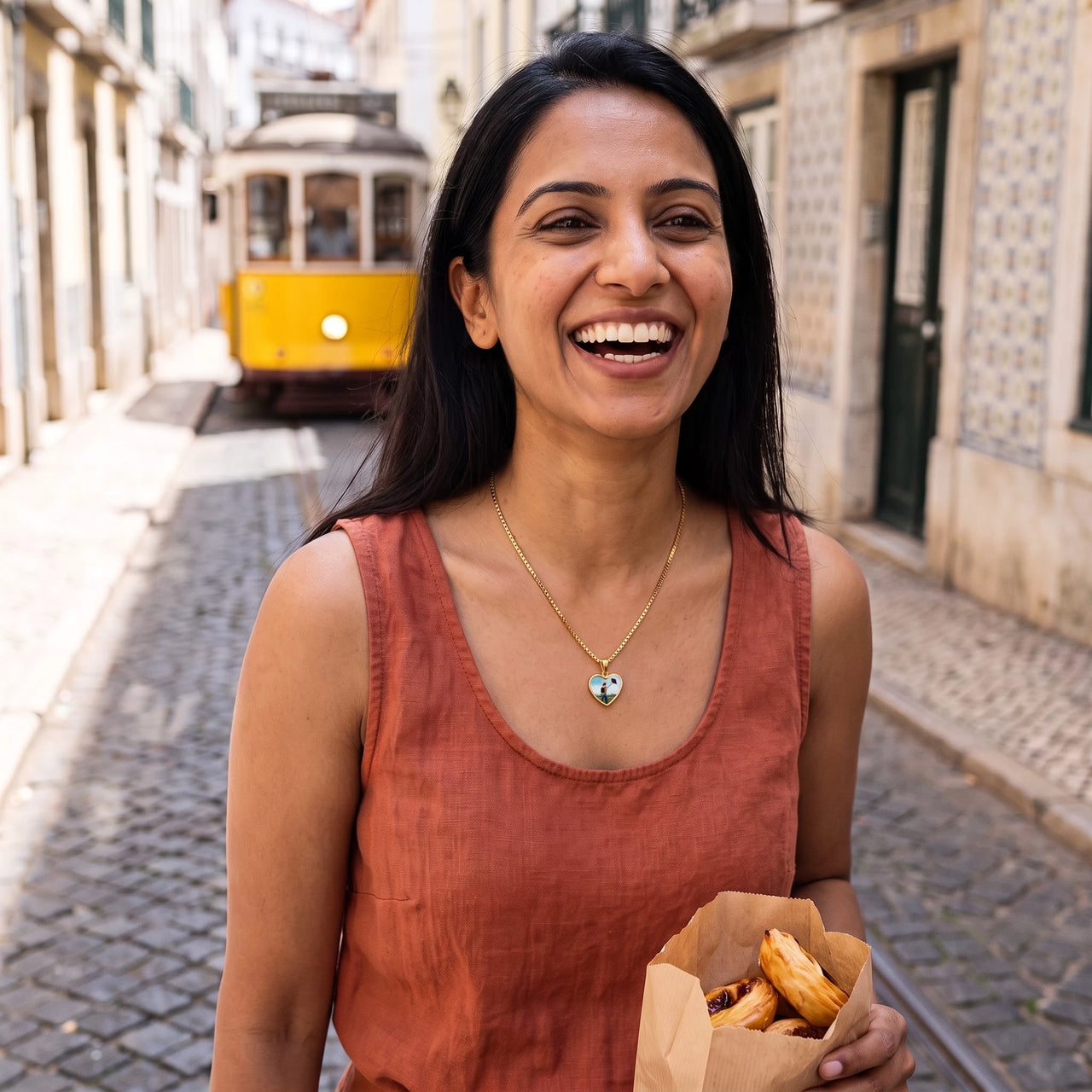 Woman in a Lisbon street wearing the gold secret heart photo necklace | SKU: TPH-CHTN-GOLD-SMALL