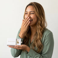 Thumbnail for Woman laughing with joy as she discovers her mother's photo in the gold heart necklace, in the Brother & Sisters gift box | SKU: TPH-HRTN-GOLD