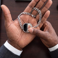 Thumbnail for Thumb warming the silver octagon bracelet plate: the hidden photo appears under the thumb while the rest stays black | SKU: TPH-OCTB-SILVER-18