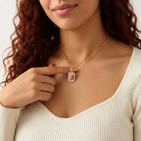 Thumbnail for Woman wearing the gold oval photo necklace with her baby's photo | SKU: TPH-OVLN-GOLD