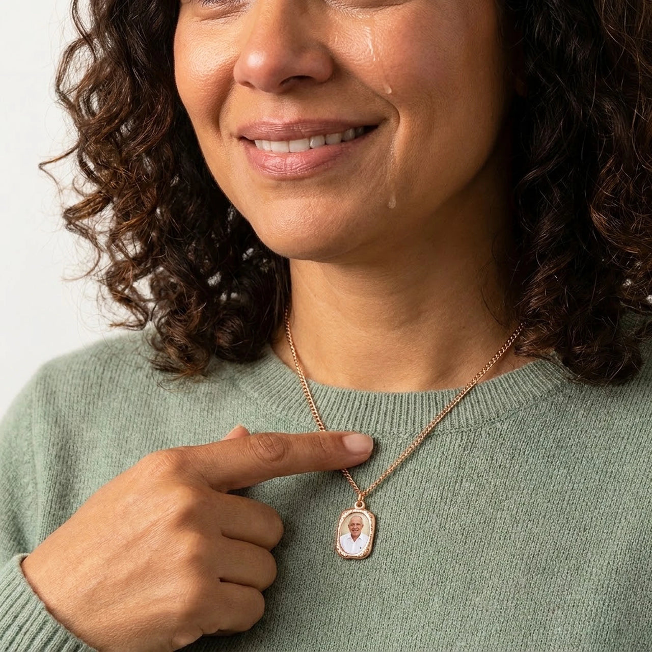 Woman moved as she looks at her late father's photo in the rose gold oval necklace | SKU: TPH-OVLN-ROSEGOLD