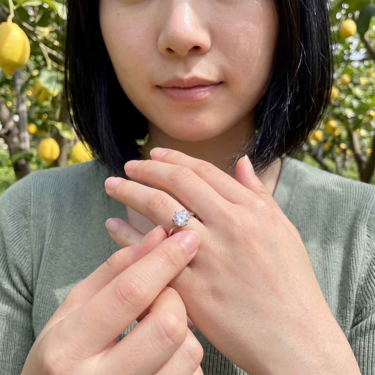 Woman gently touching her silver ring | SKU: 33759698-4.5-silver