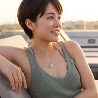 Thumbnail for Woman relaxing on holiday wearing the silver necklace | SKU: 505744