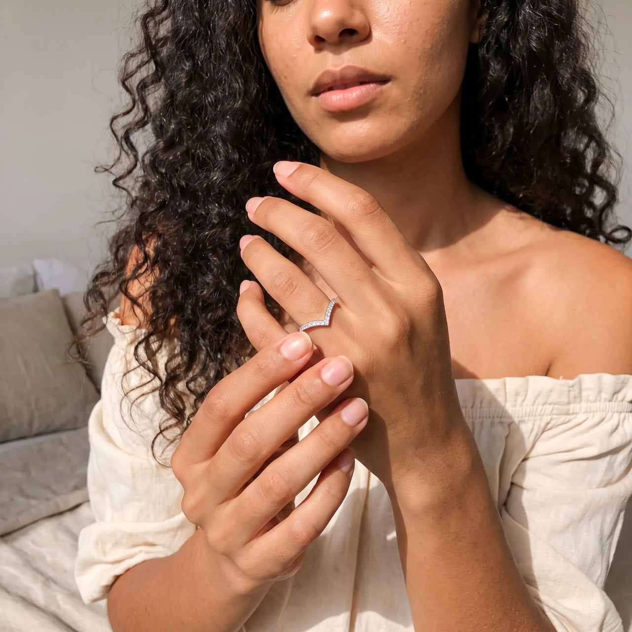 Woman gently touching her silver ring | SKU: 10645547-4.5-silver