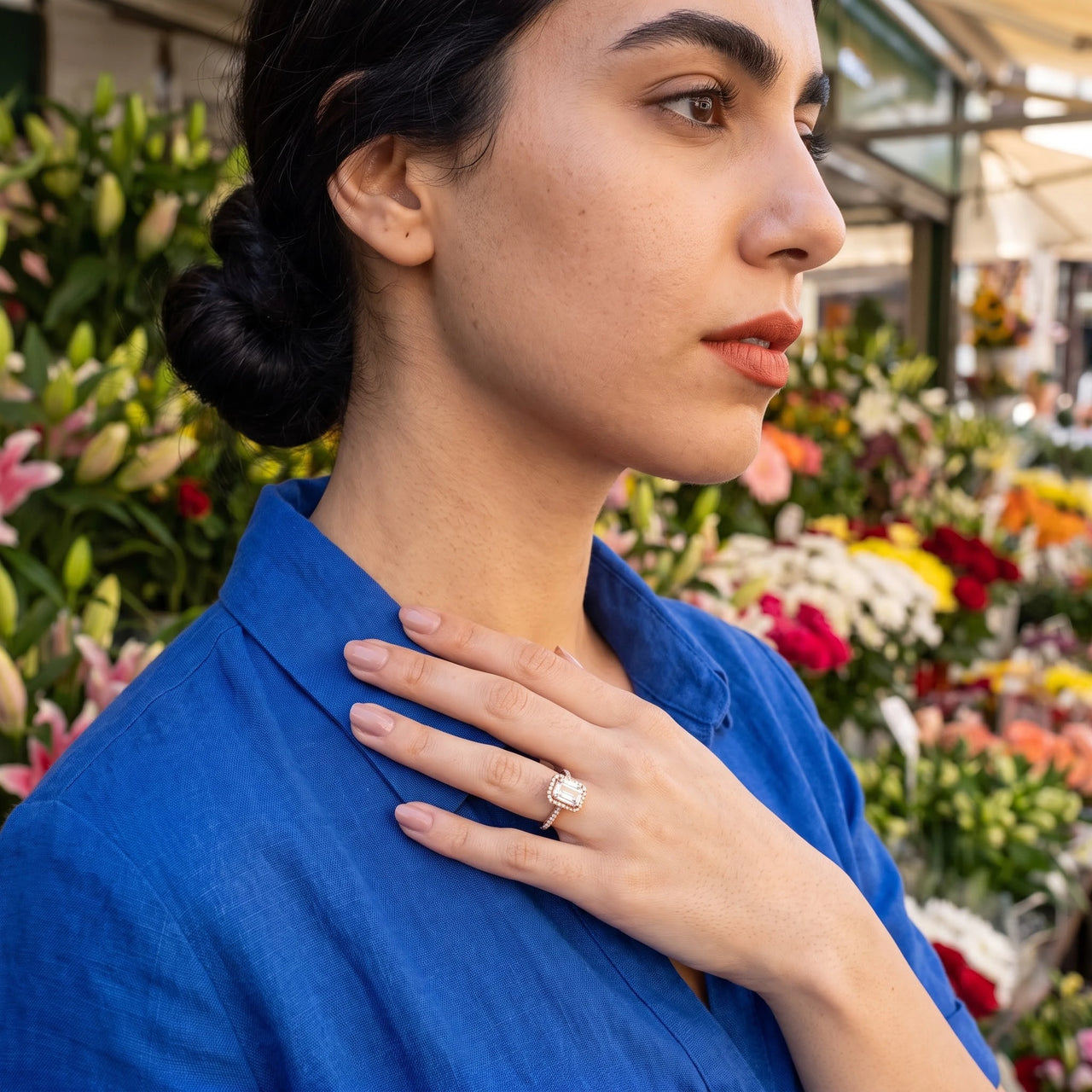 Woman gently touching her Rose Gold Rectangle Ring | SKU: 1969566-4-5-rose-gold