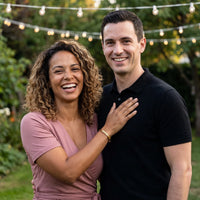 Thumbnail for Couple moment, she wears the Travel To Feel Alive bracelet in gold | SKU: ttfa-g