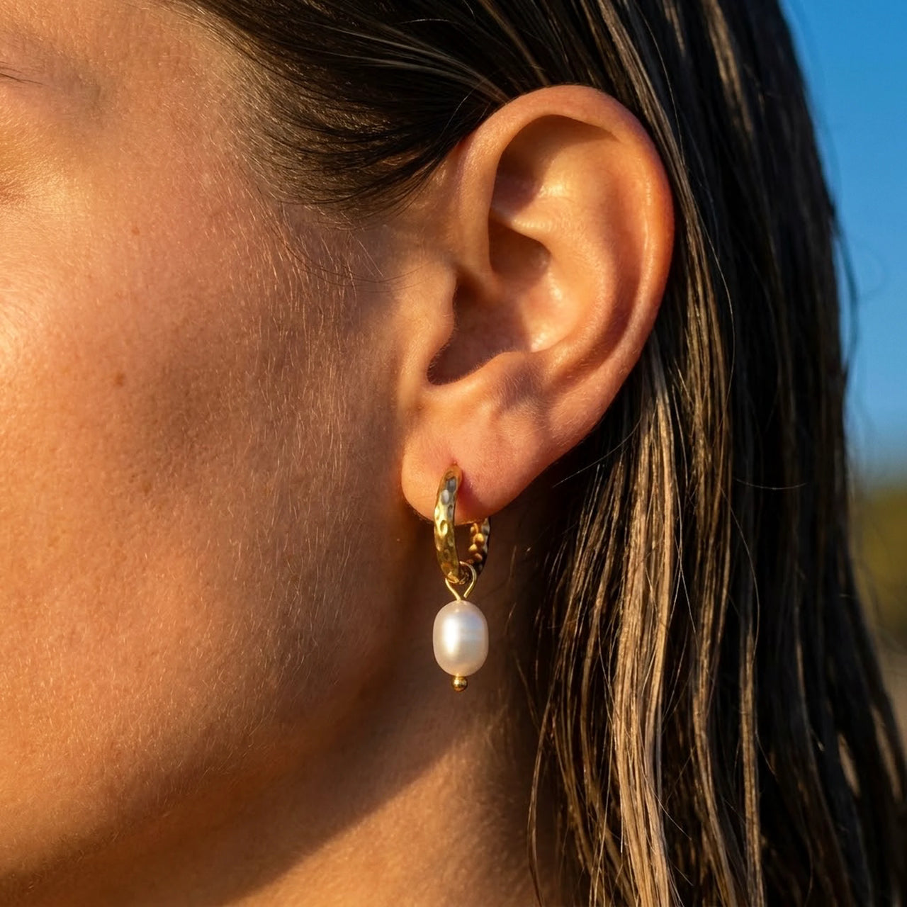 Twisted Pearl Drop Hoops in Gold, close-up on the earlobe | SKU: 41004-gold
