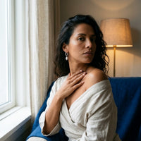 Thumbnail for Twisted Pearl Drop Hoops in Silver, worn by a window | SKU: 41004-silver